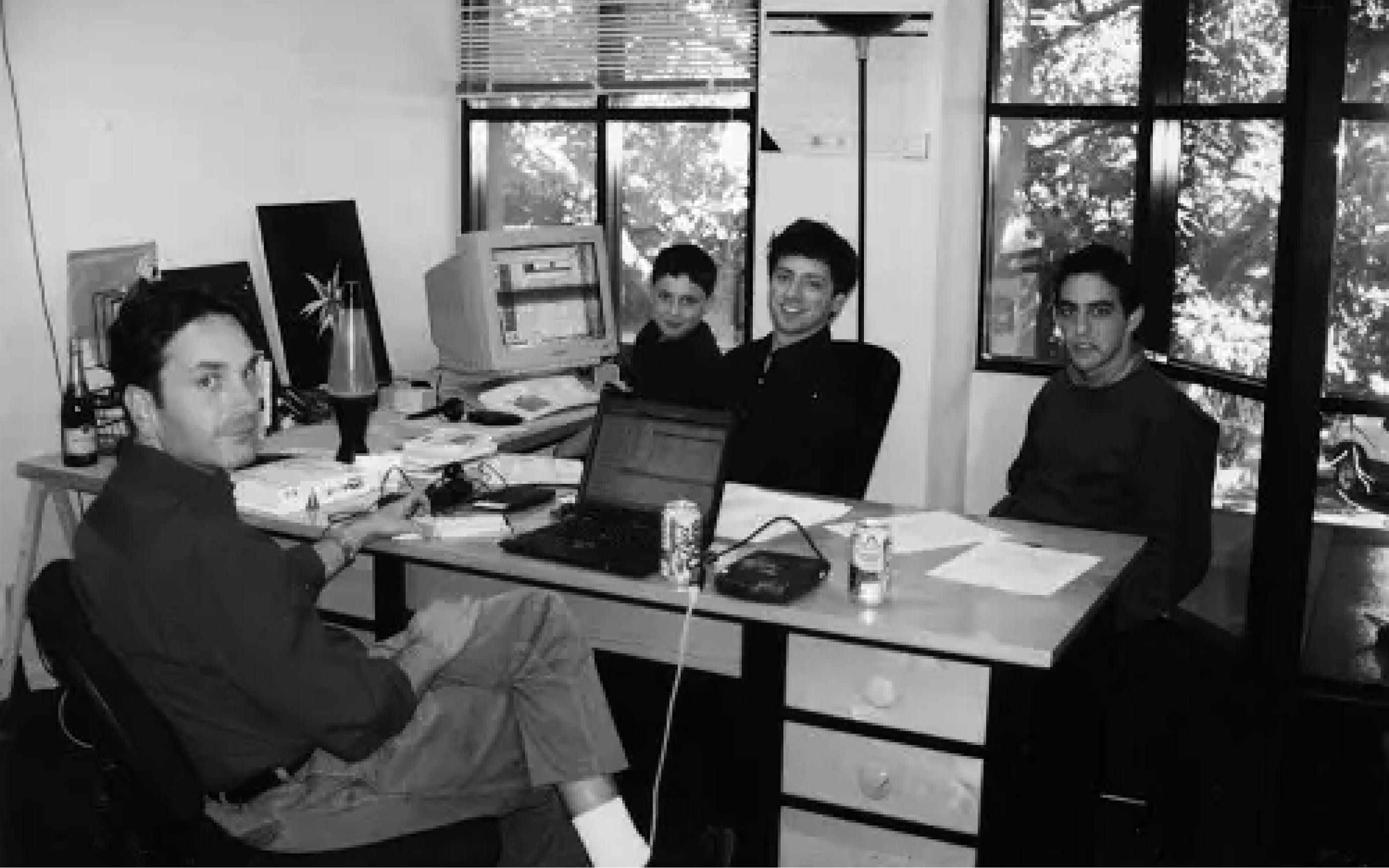 photo of google founders sharing a single desk