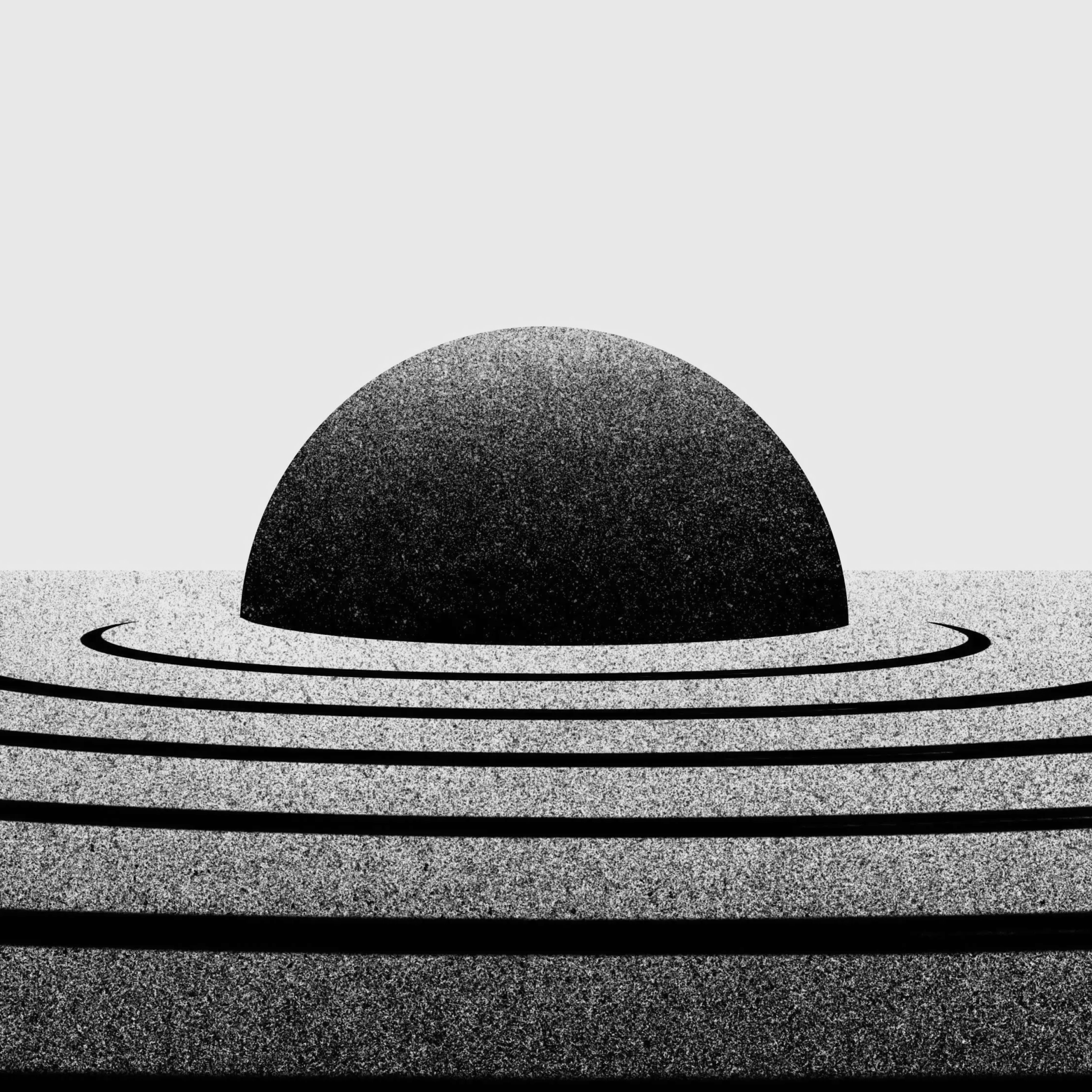 An illustration of a black semi-circle resembling a setting or rising sun against a bright yellow background. The semi-circle is surrounded by concentric black rings that gradually fade into the yellow background, creating a ripple effect.