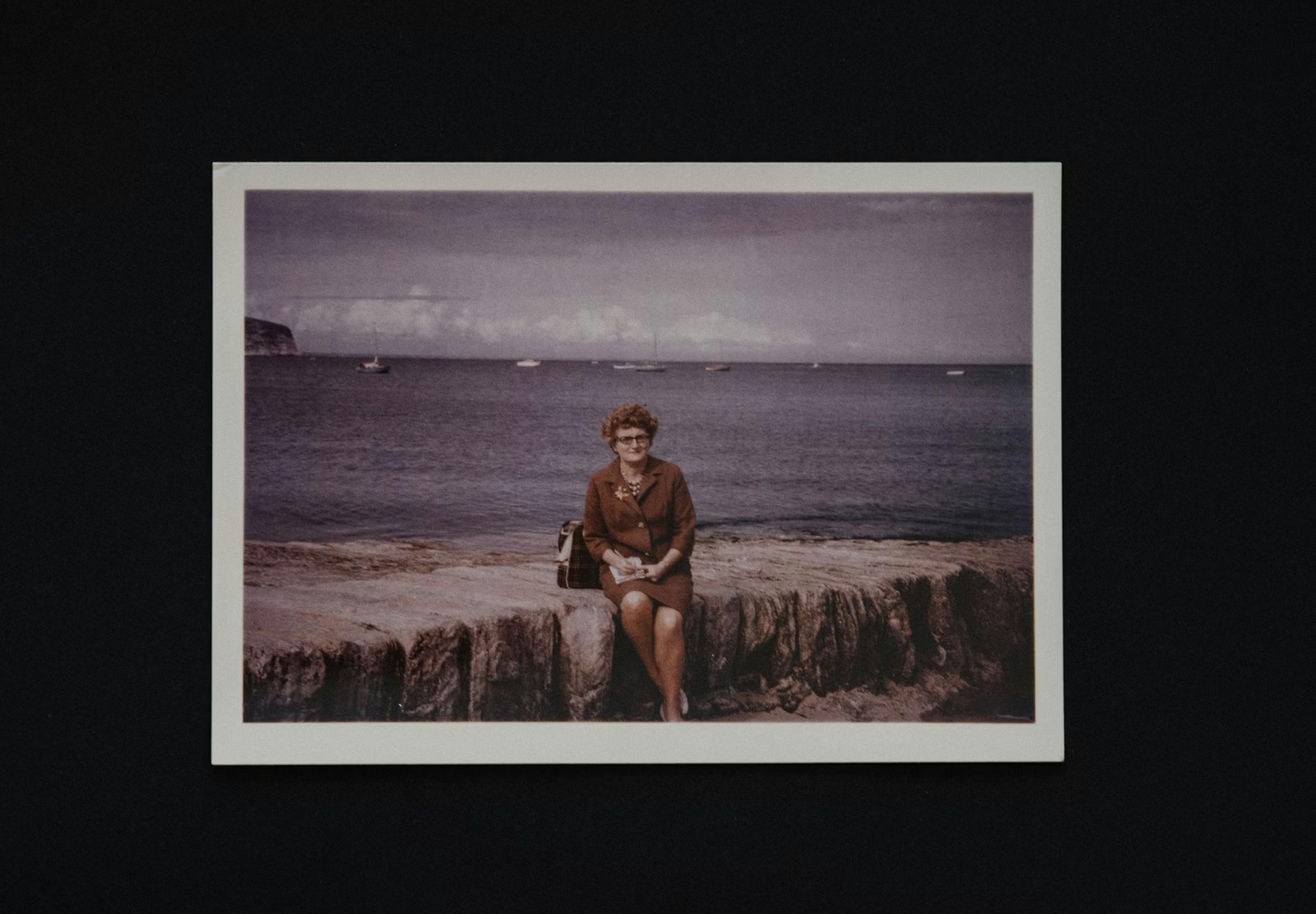 old photography of a person by the ocean