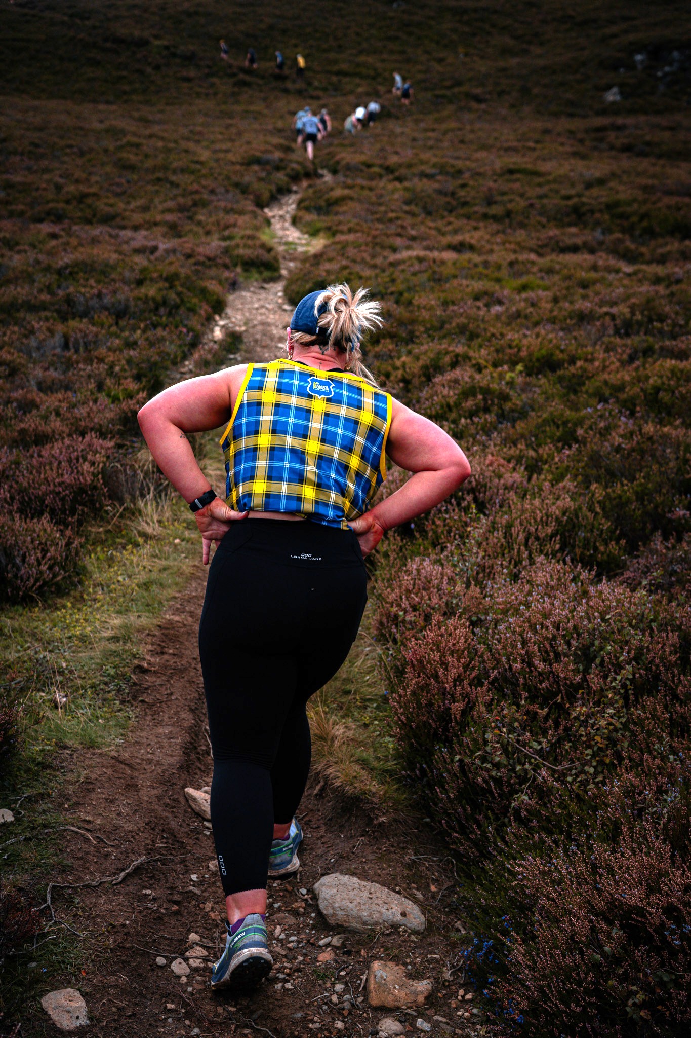 Hiker in My Name's Doddie Foundation tartan top.