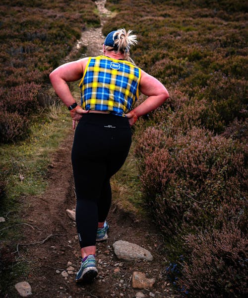 Hiker in My Name's Doddie Foundation tartan top.