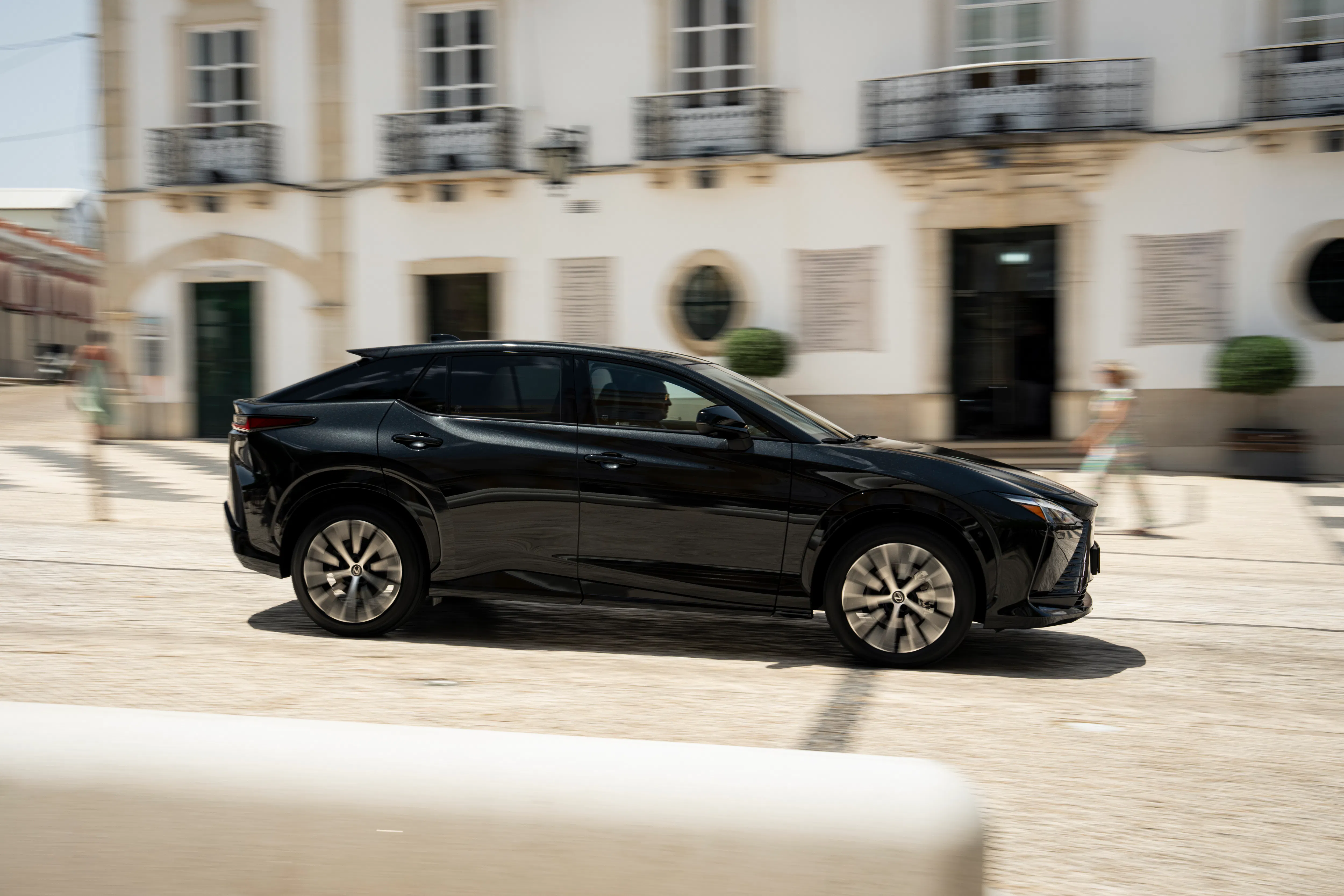 A Lexus RZ500e driving on a motorway - Image 4