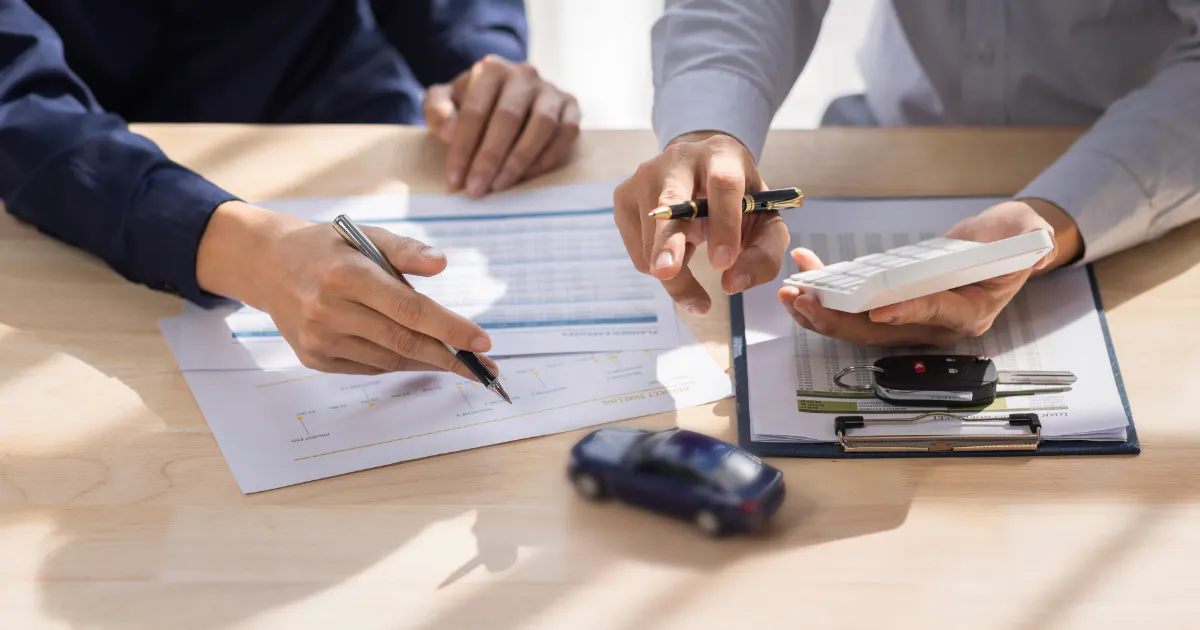 two people looking at finance documents
