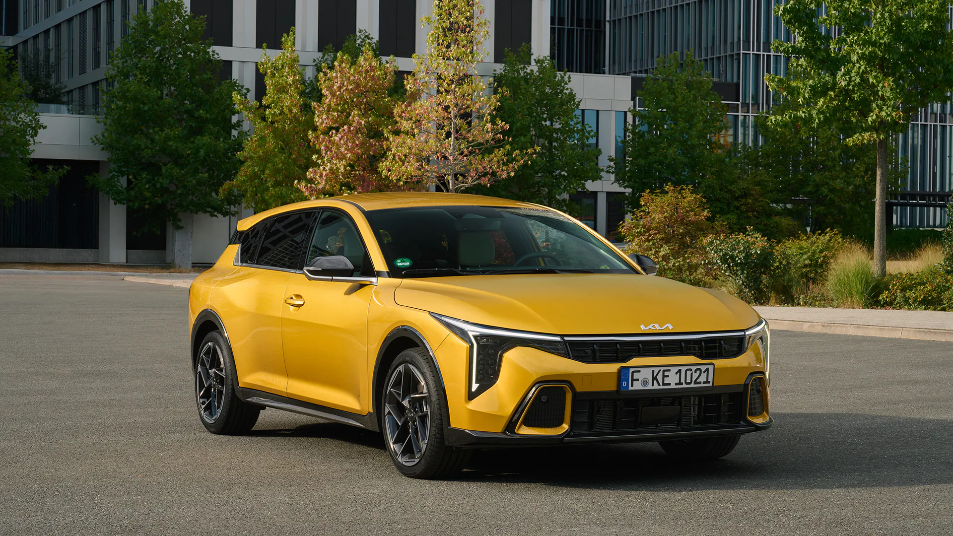 A Kia K4 driving on a road - Image 4
