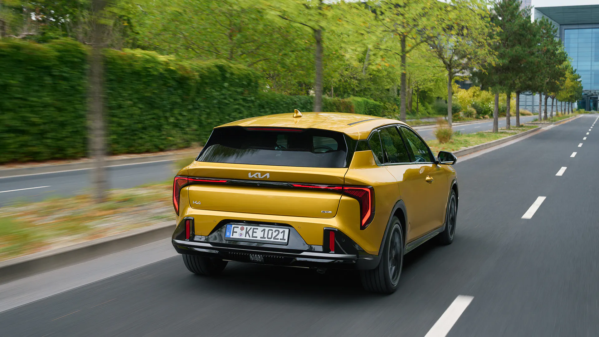 A Kia K4 driving on a road - Image 2