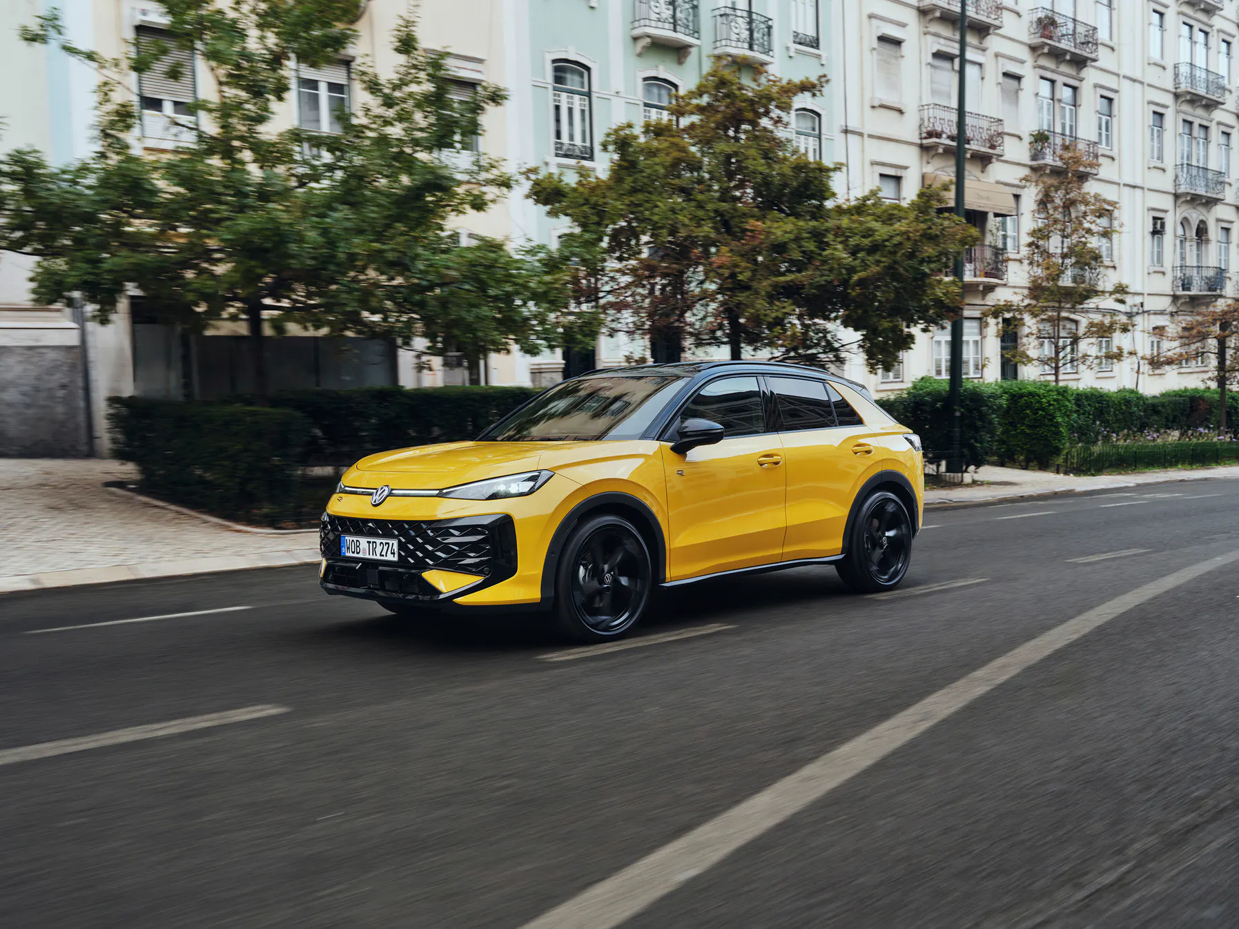 A yellow VW T-Roc Driving - Image 1