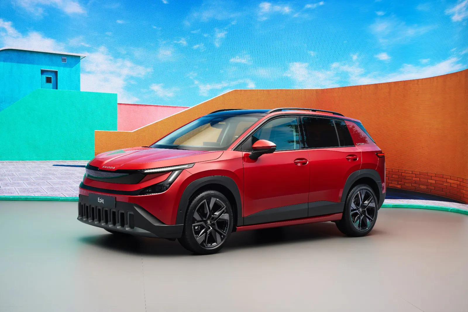 A red Skoda Epiq in a studio