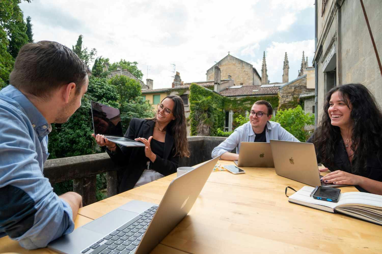 Group of people happy working with laptops