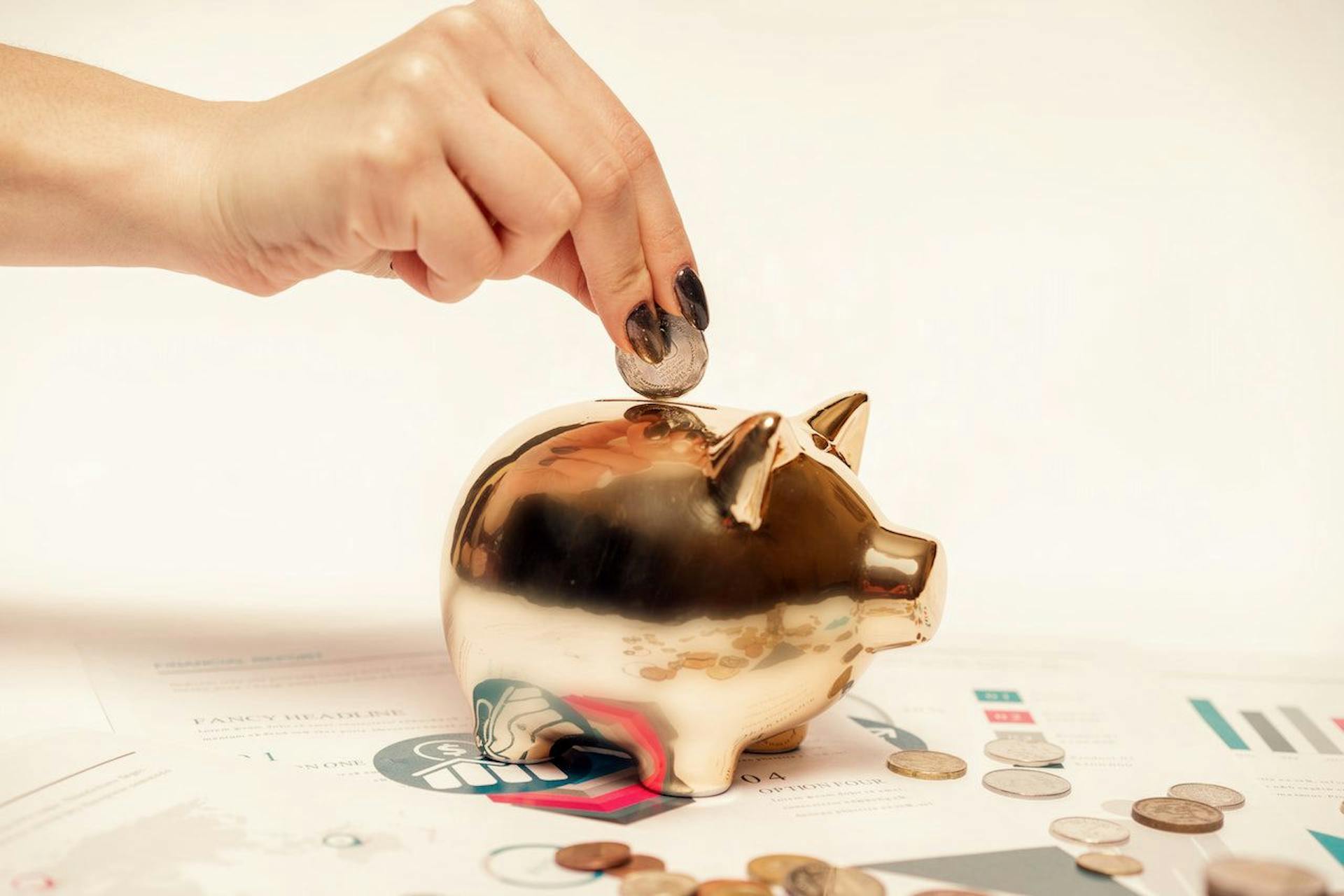 Placing money in piggy bank