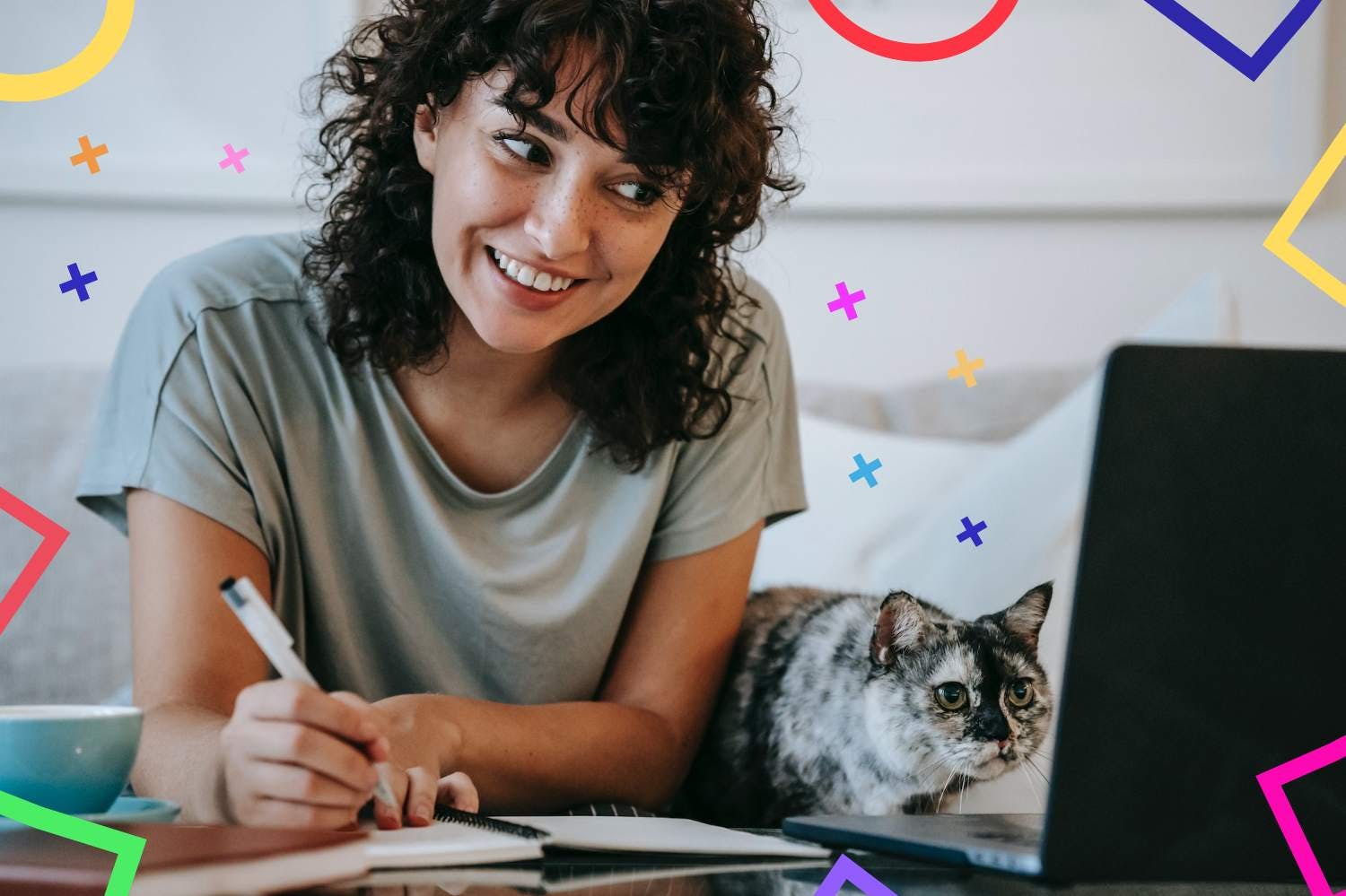 Worker looking excited at screen and taking notes