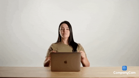 Woman dancing at laptop