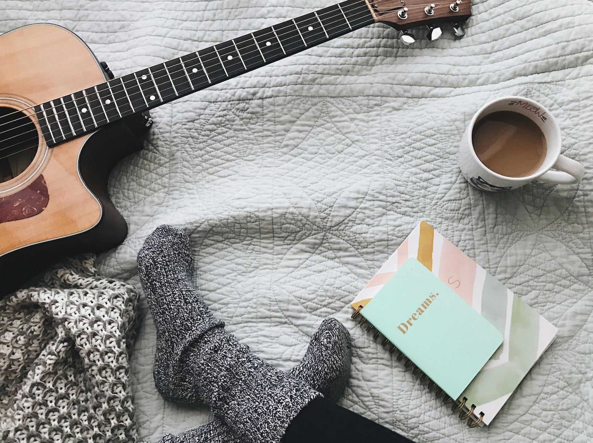 Guitar on bed