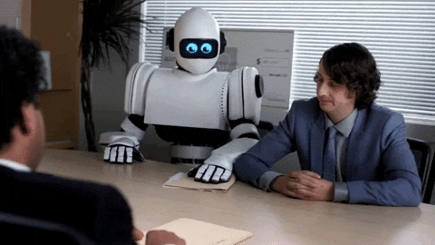 Robot handing person notes in a meeting