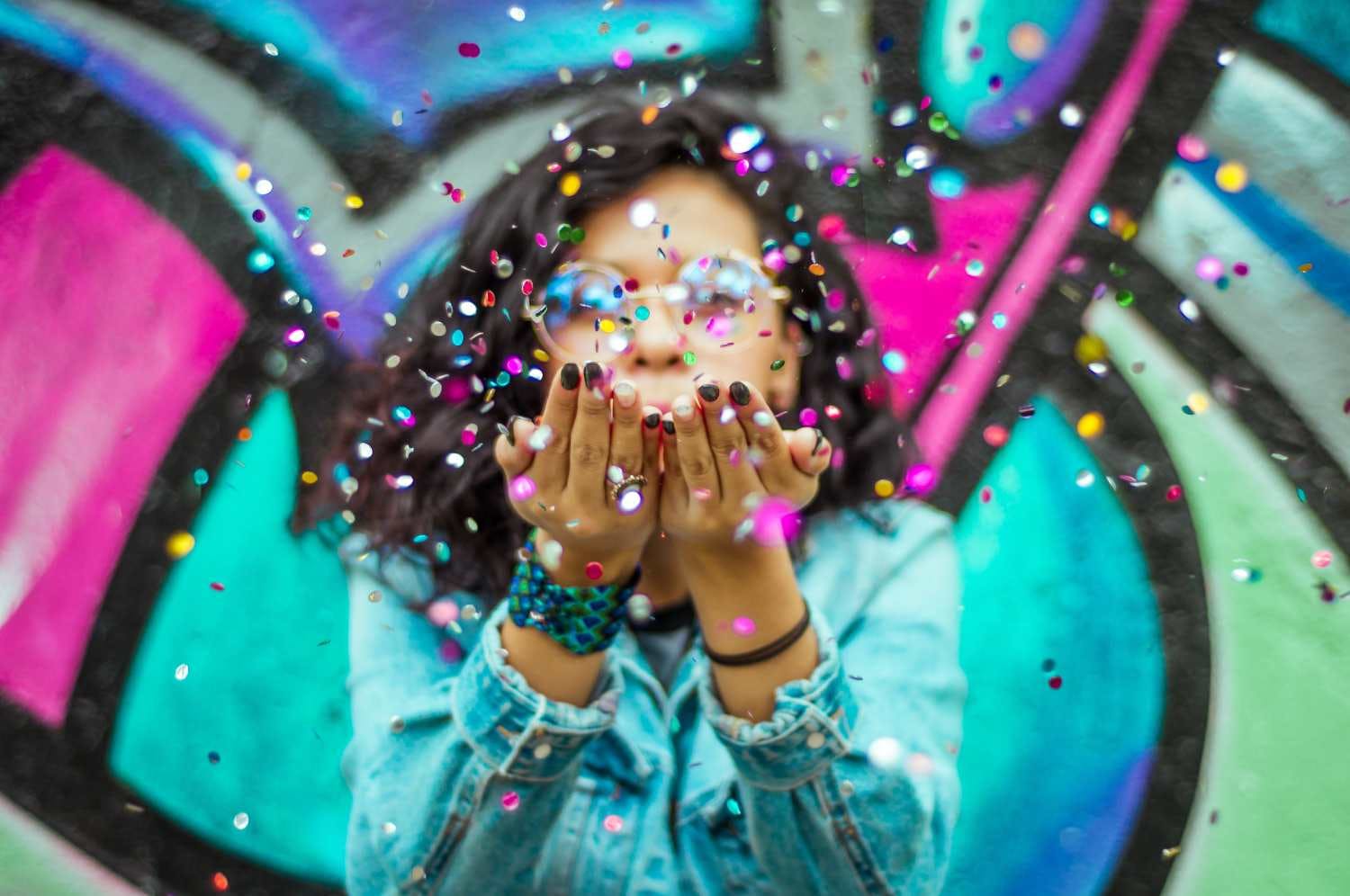 Person blowing confetti