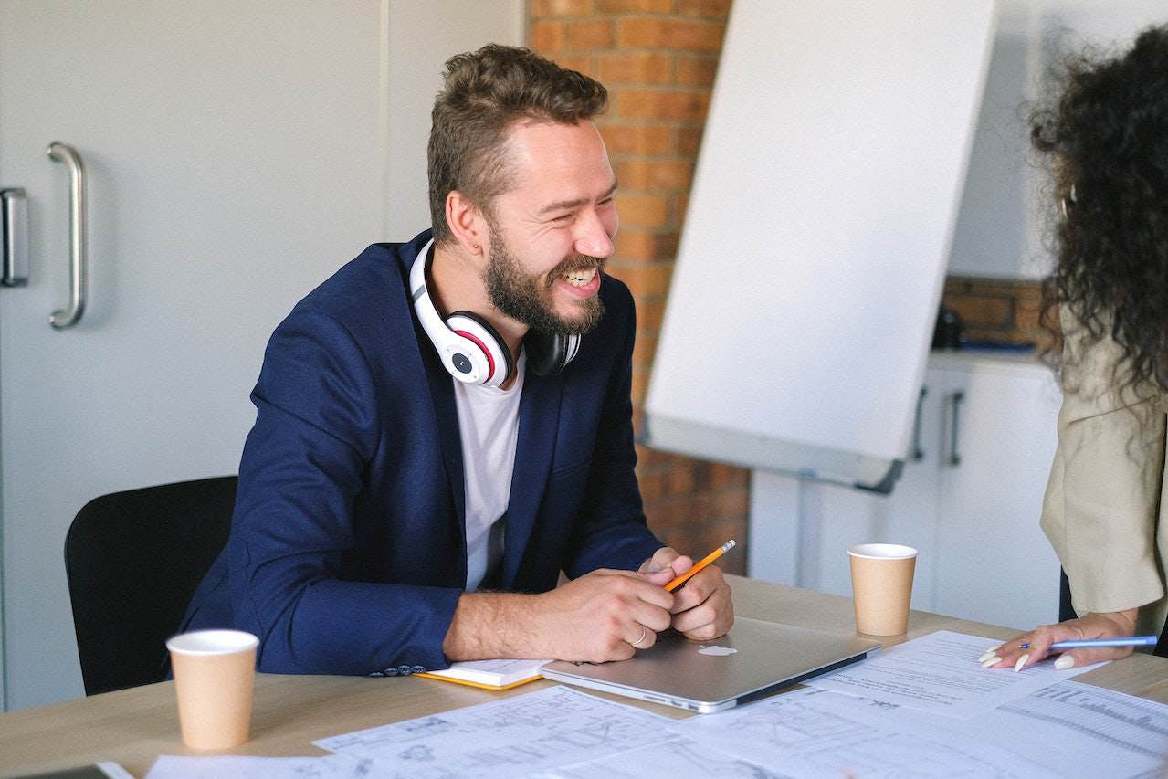 Man at desk happy