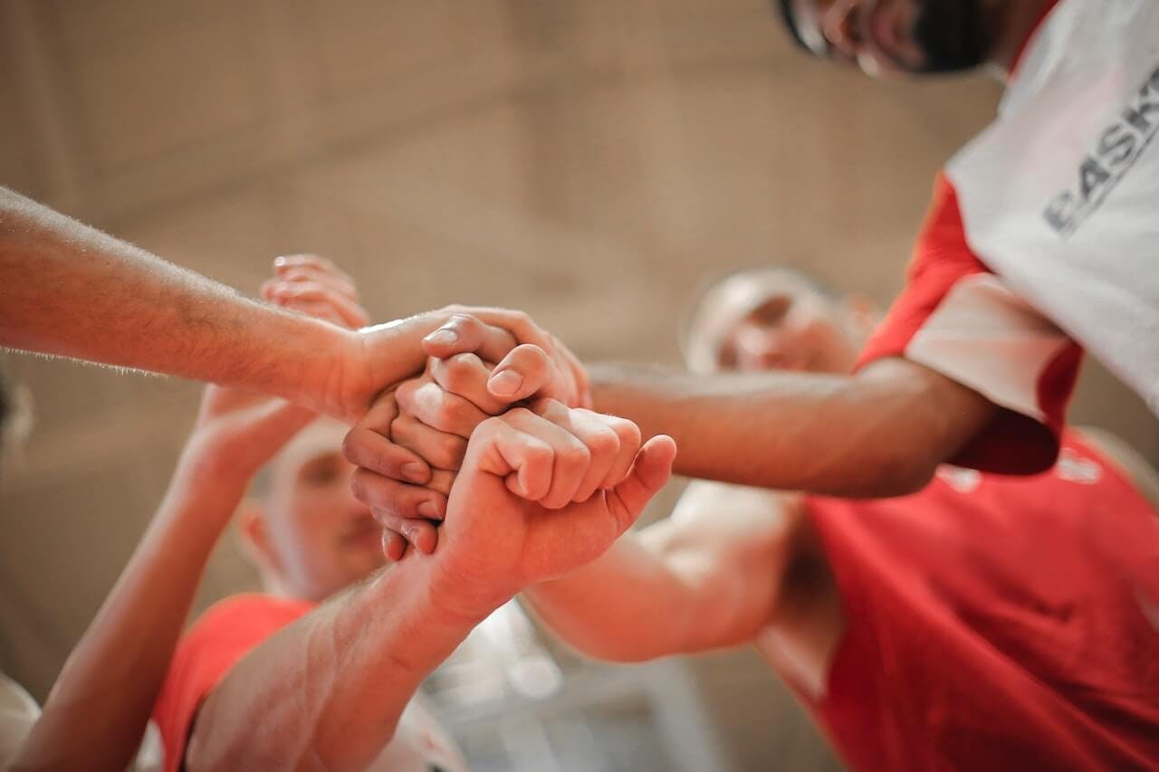 Team holding hands