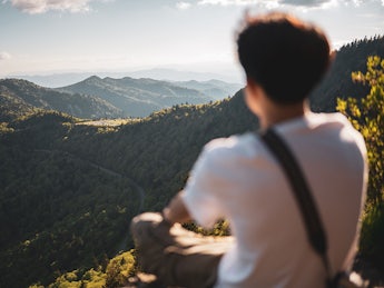 Person looking at mountains.