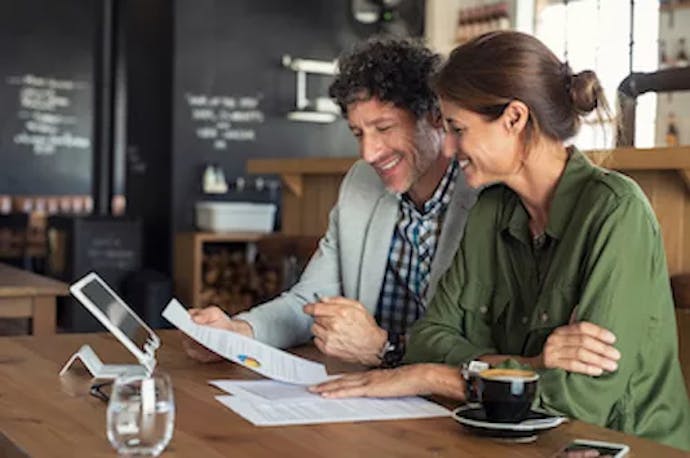 Man and woman looking over finances