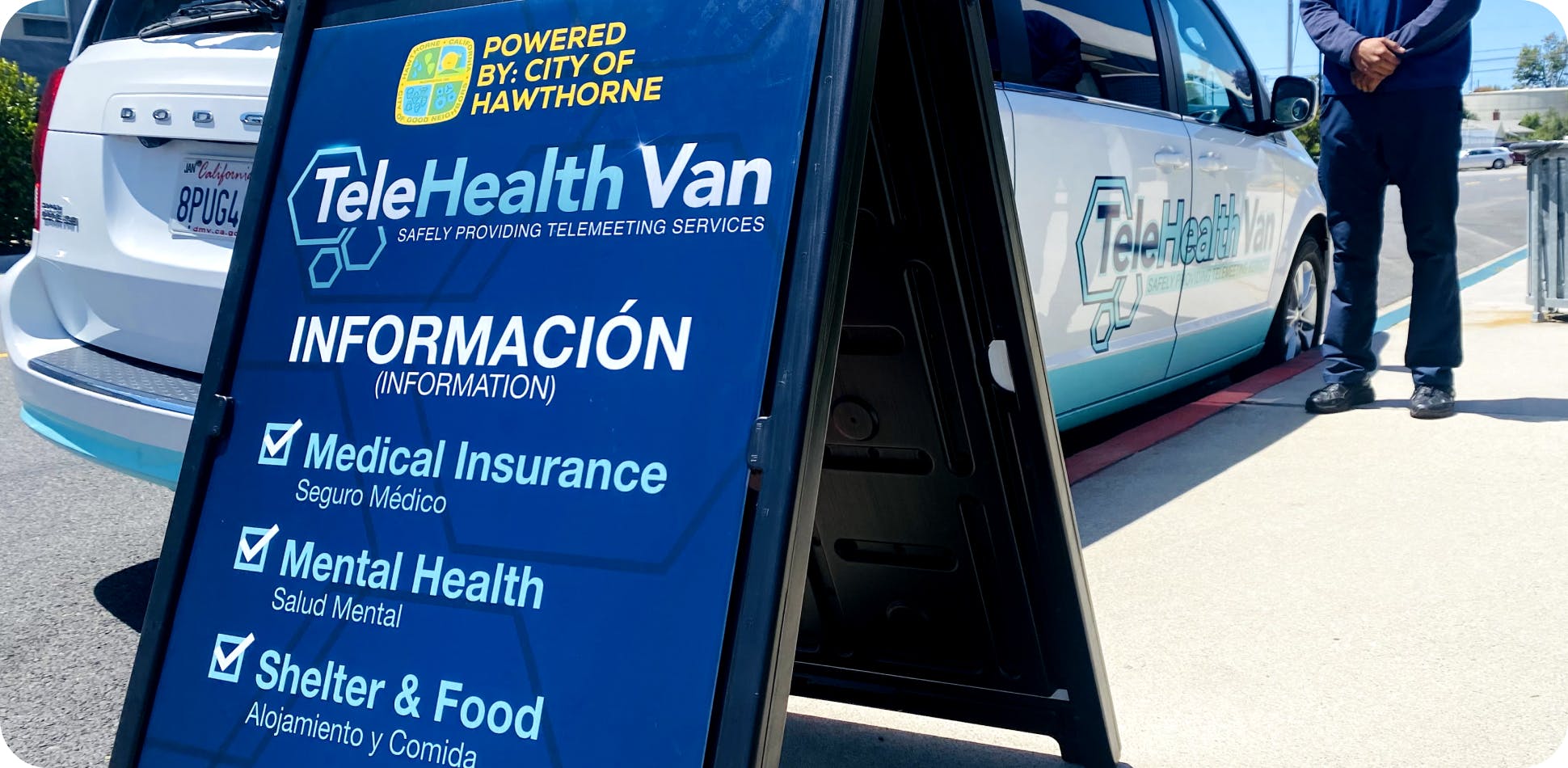 Sandwich board sign in English and Spanish promoting TeleHealth Van Services