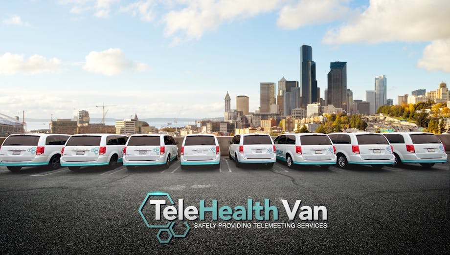 TeleHealth Vans parked in front of LA skyline