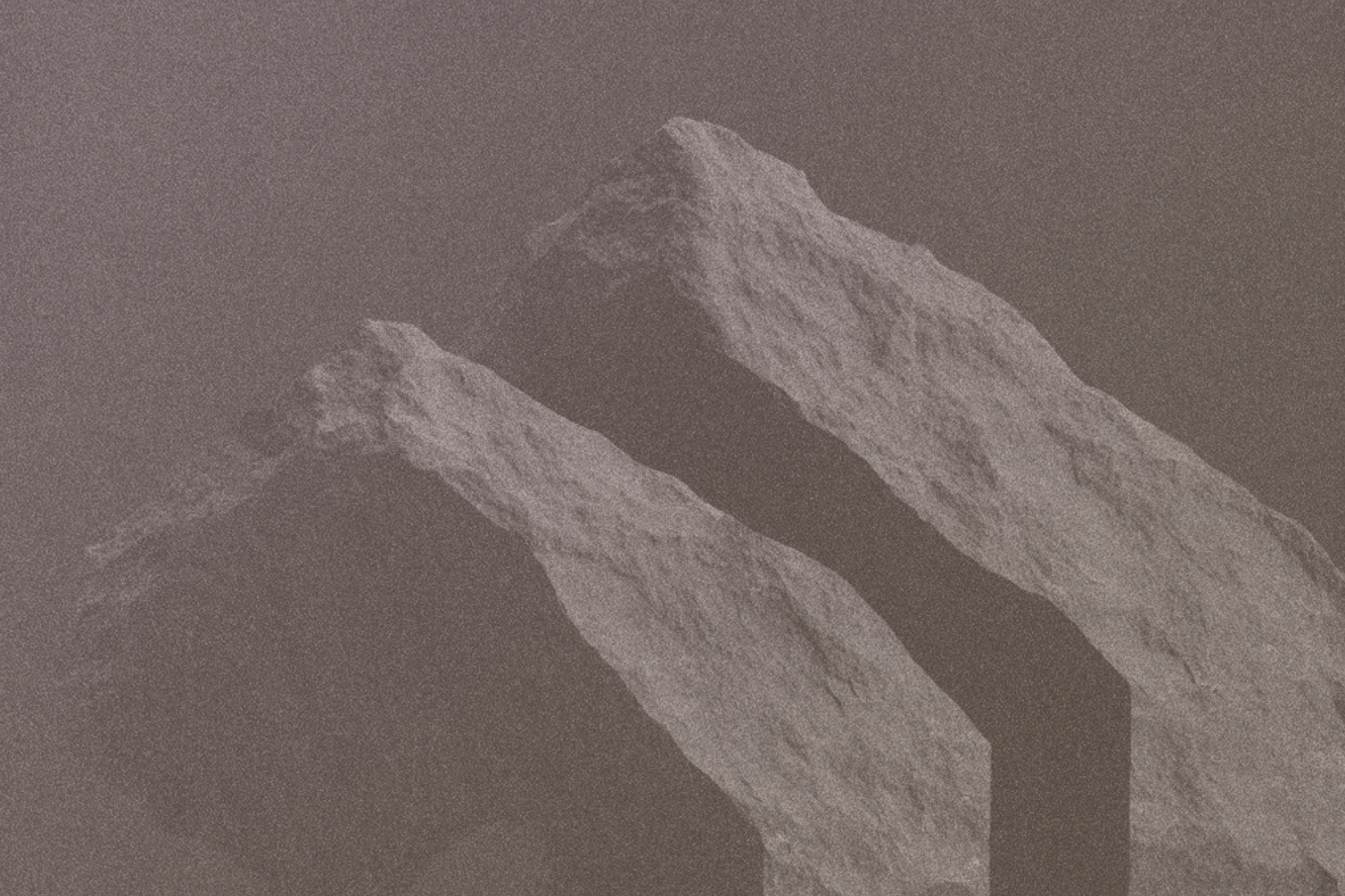 Mynd af kletti á brúnum bakgrunni.