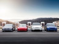 Tesla electric car line up at supercharger