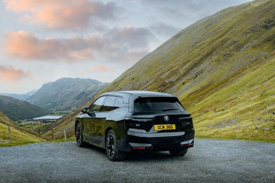 BMW parked in mountain, hill, scenery
