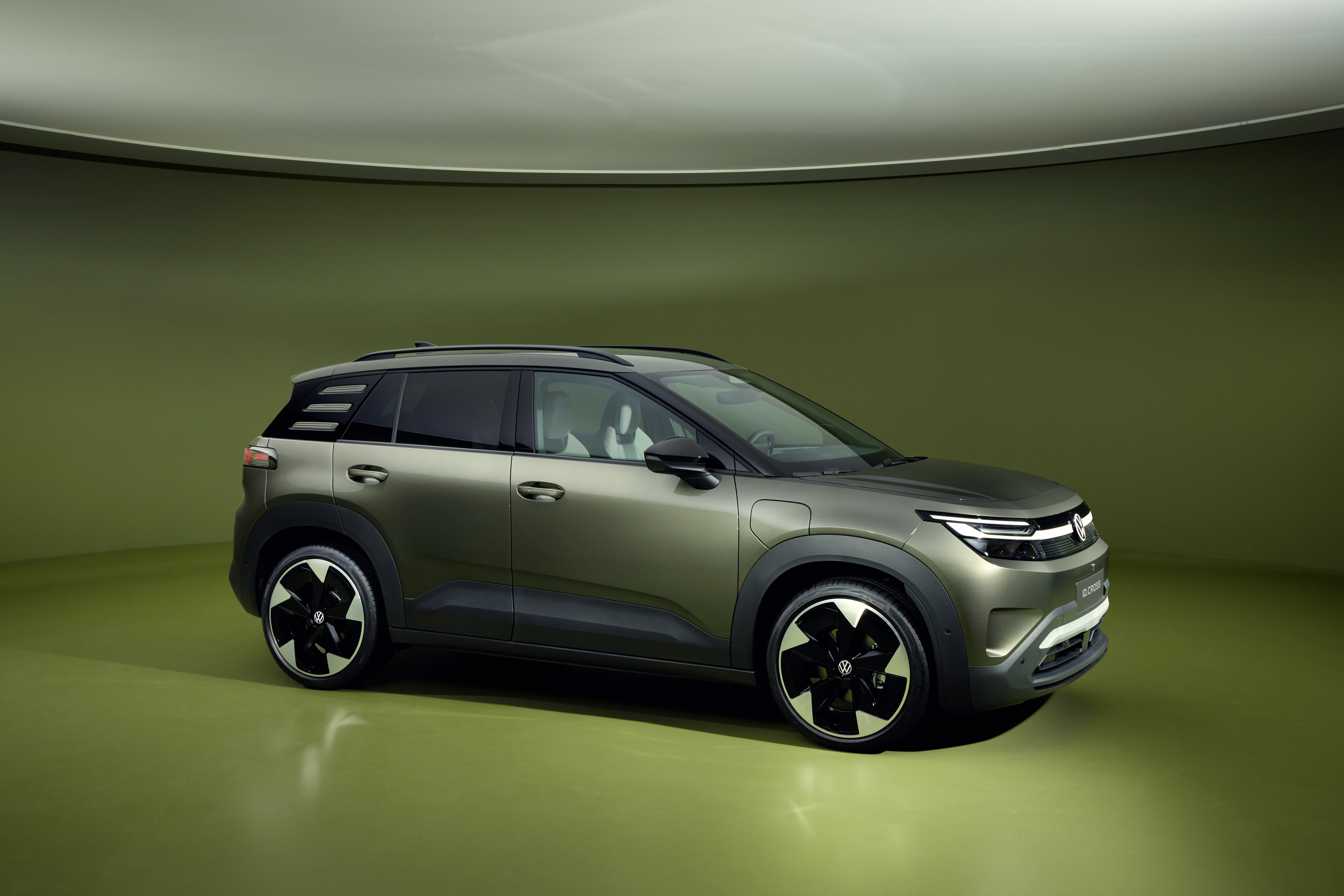 Volkswagen electric car id cross model render, green car on green background side view
