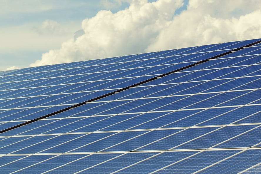 Solar panels with cloudy sky