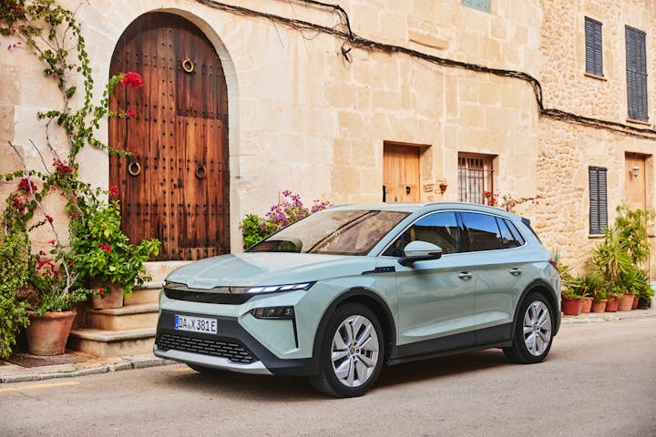 Skoda Elroq electric car parked on street with greenery