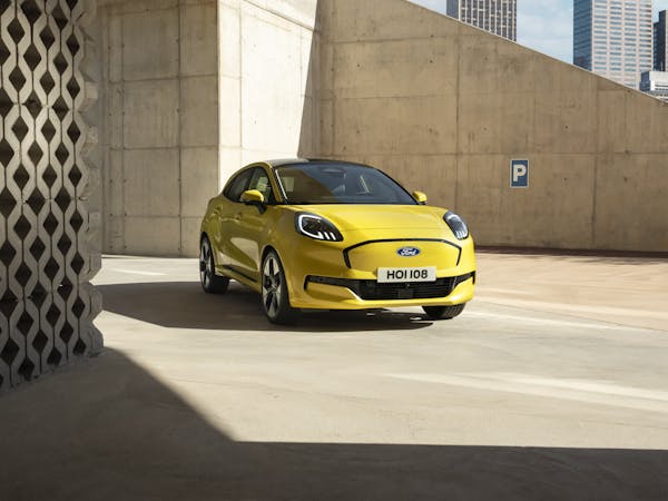 Ford Puma Gen e yellow electric car front profile in car park