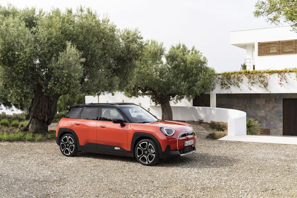 mini aceman electric car side view in orange