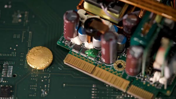 Piece of Gold extracted from e-waste on an electrical circuit board (Image credit: BBC/Kevin Church)