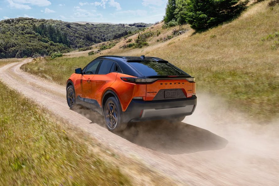 Subaru uncharted electric car in orange driving on an offroad track