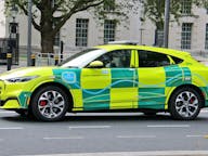 NHS electric car ambulance in urban setting