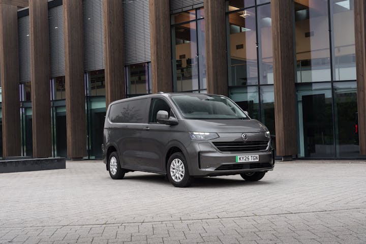 Volkswagen eTransporter electric van parked near modern offices