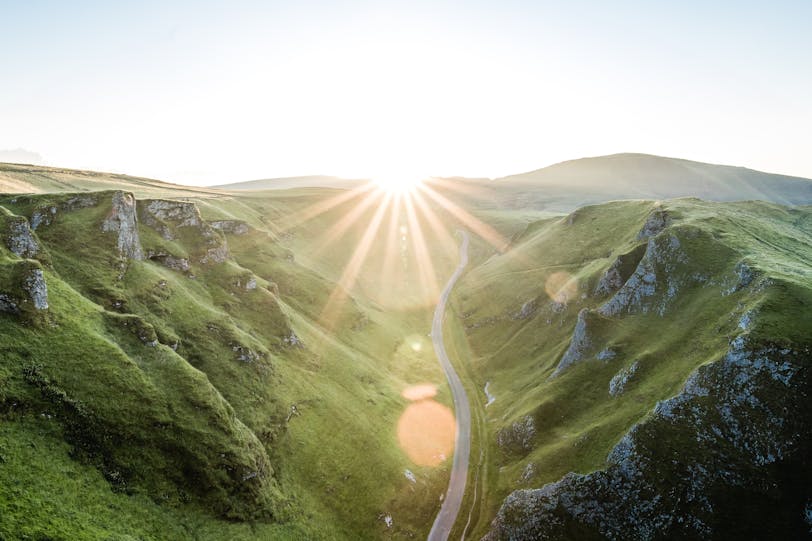 Road in British countryside with sun beam