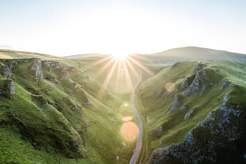 Road in British country side with sun beam 
