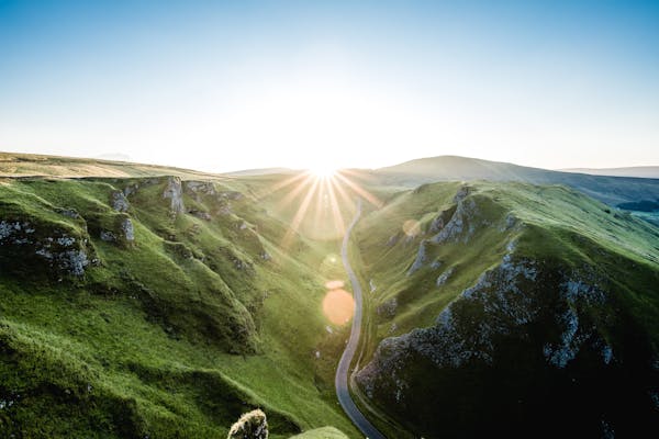 Road in British country side with sun beam 
