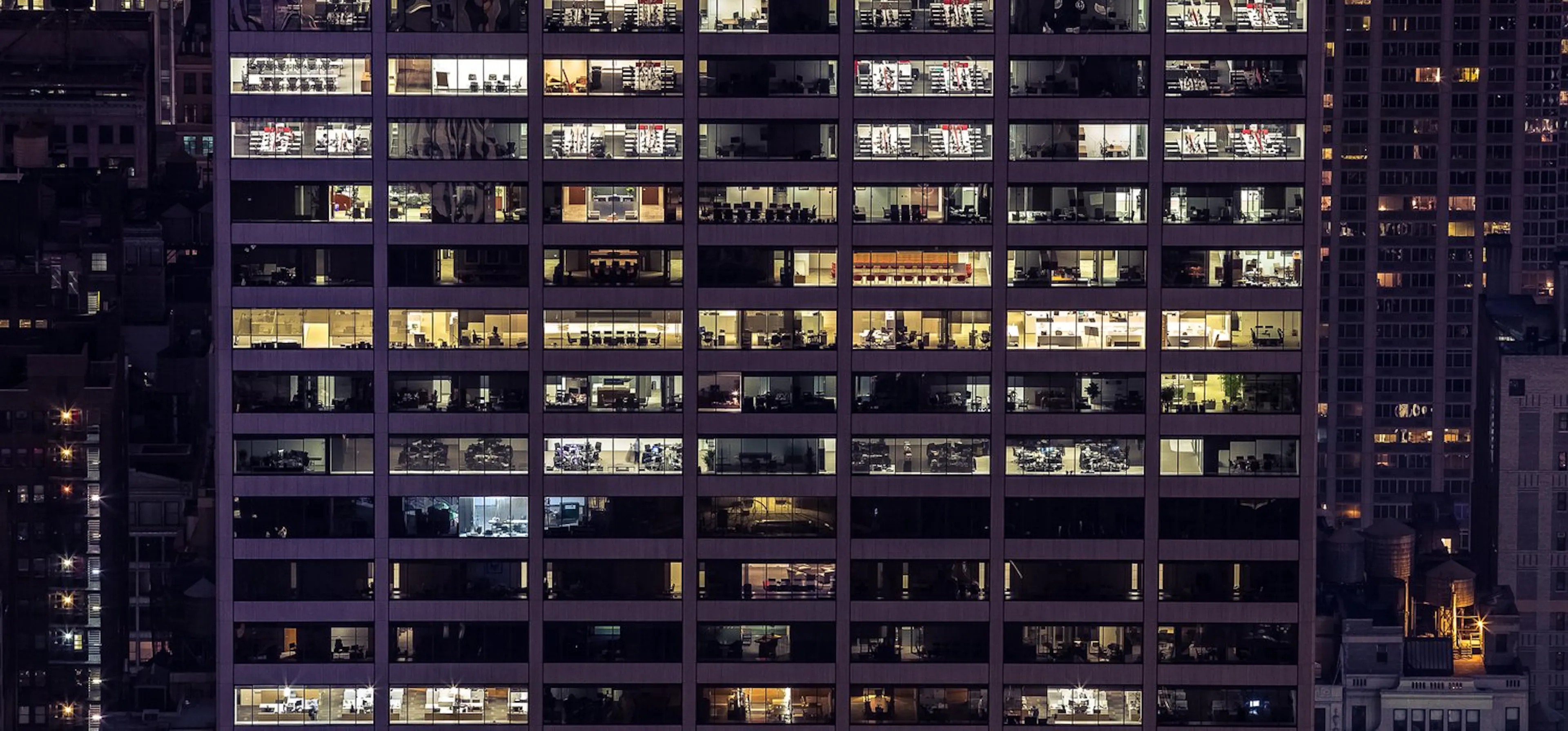 Office tower with lit windows at night