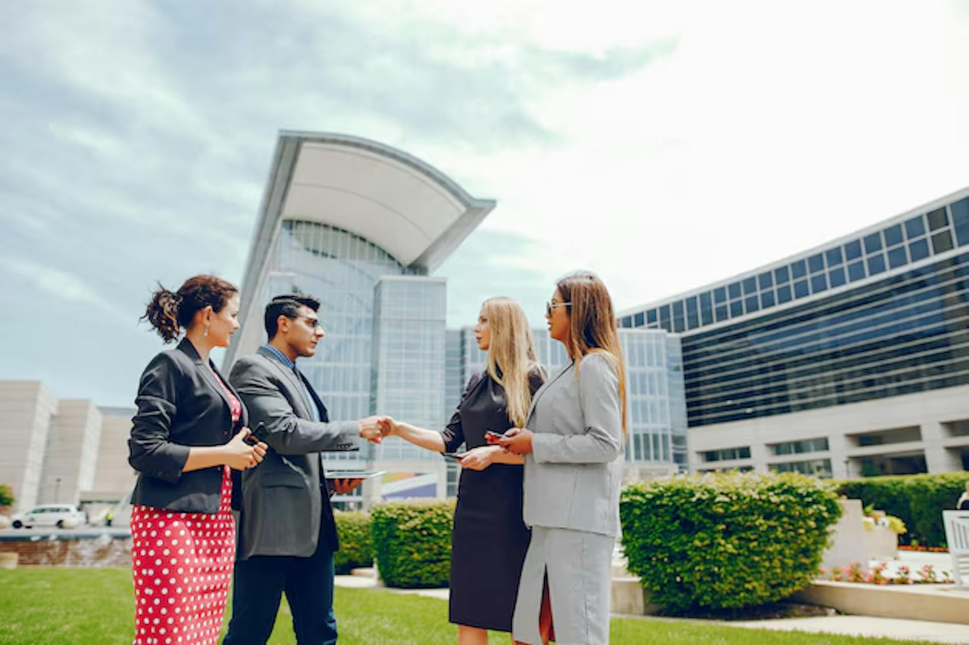 businessman meeting three professional women in business