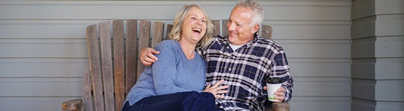 Mature couple on a porch enjoying time together