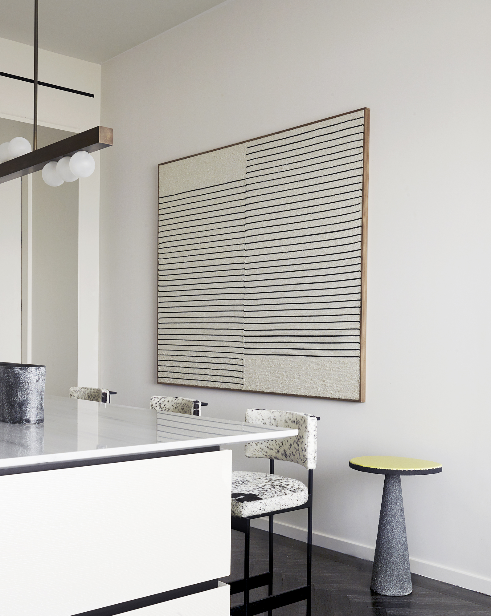 Chelsea Residence kitchen, island with upholstered bar stools, artwork