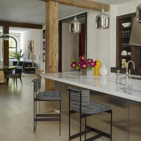 Kitchen bar seating, open plan apartment with exposed columns