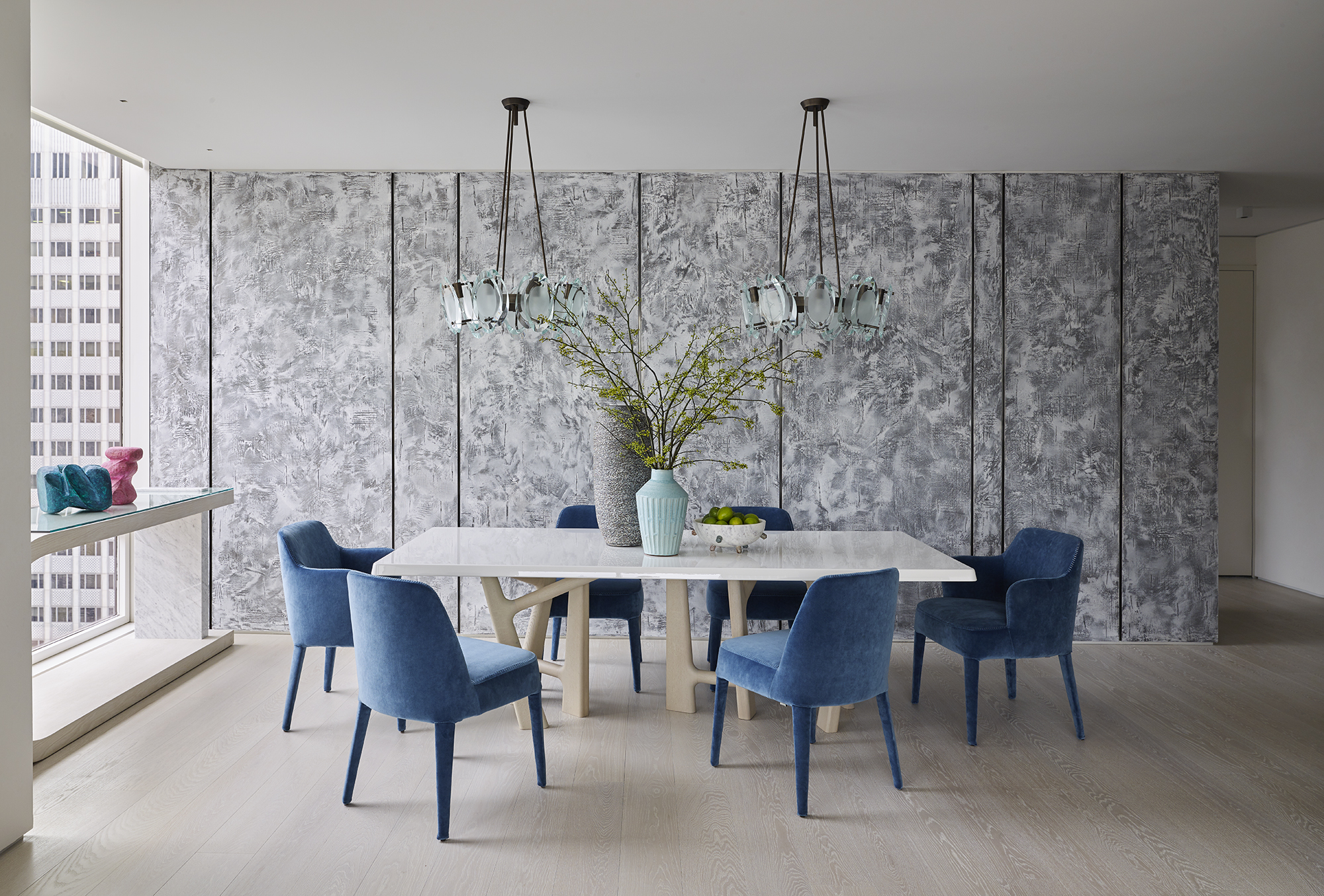 Dining Room with specialty plaster wall panels, pendant lights, modern furnishings