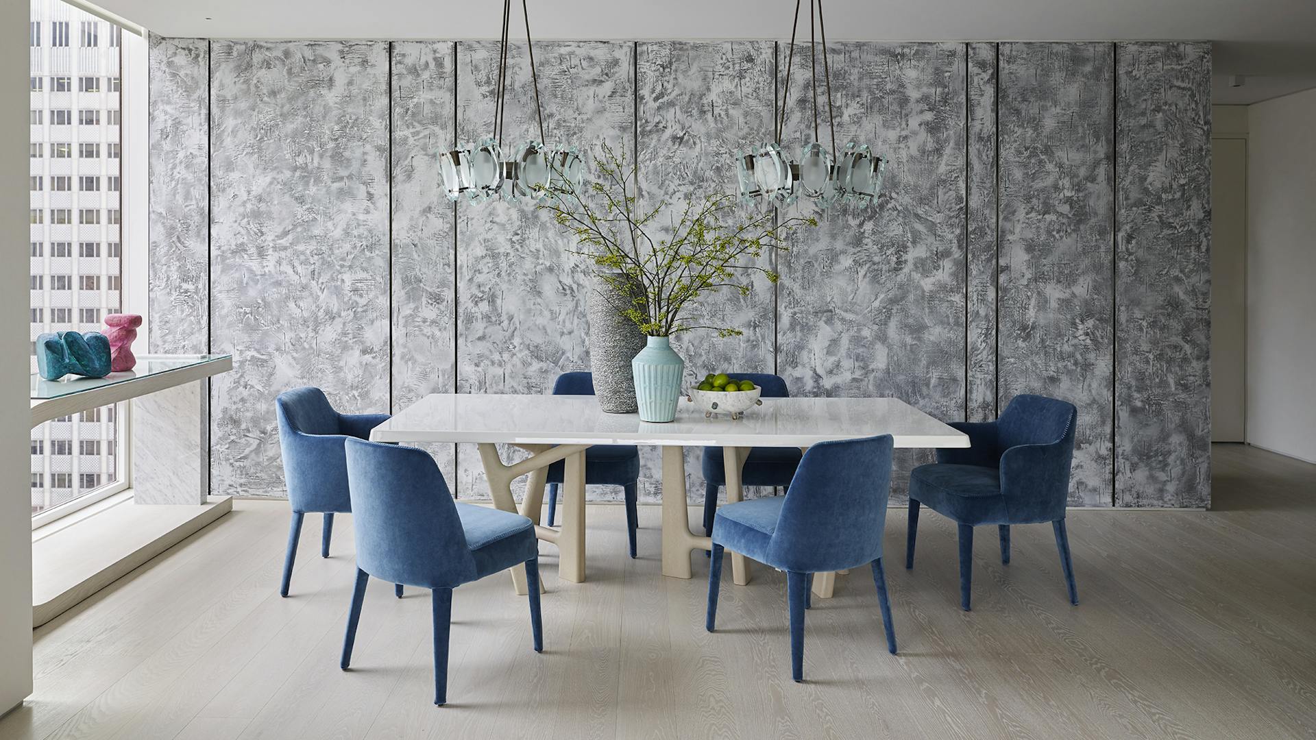 Dining Room with specialty plaster wall panels, pendant lights, modern furnishings