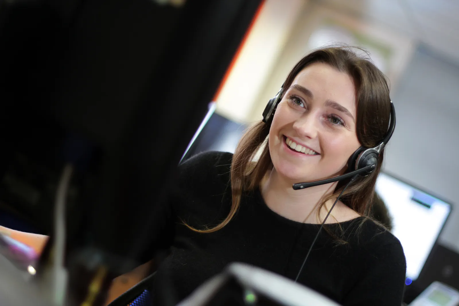 Hillarys contact center consultant smiling warmly while talking to a customer 