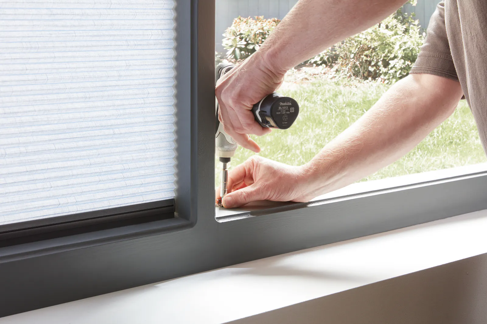 Installation of white Duette® honeycomb blinds