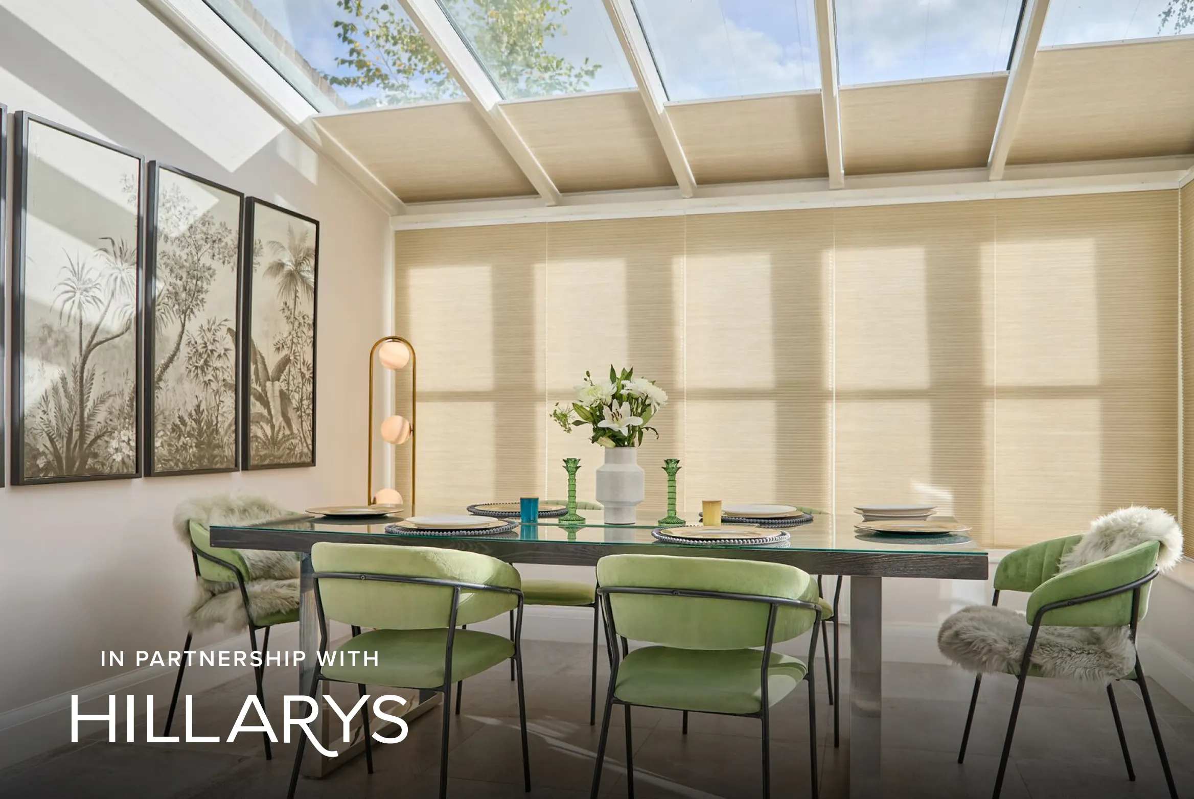 Cream Duette® honeycomb blinds on large wall and roof windows in a light dining room