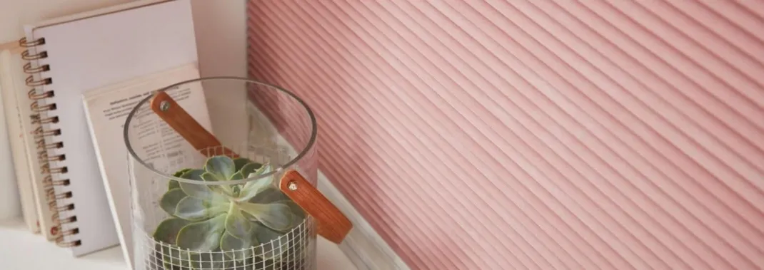 Close-up of light pink Duette® honeycomb blinds